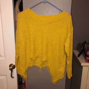 Yellow sweater with fringed bottom